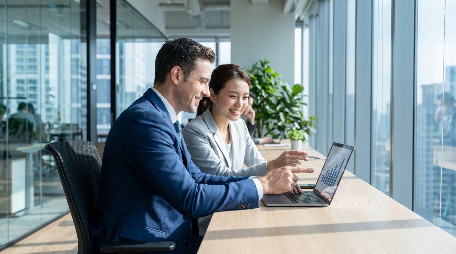 Business professionals reviewing data analytics